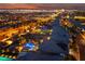 Night aerial showcasing the community, rooftops, and distant city lights, highlighting property location at 10084 Terrastone Dr, Las Vegas, NV 89148