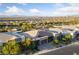 An elevated view of several modern homes in a suburban neighborhood with mountain views at 10084 Terrastone Dr, Las Vegas, NV 89148