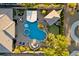 An upscale outdoor space with a lagoon-style pool, jacuzzi, putting green, and covered lounge areas at 10084 Terrastone Dr, Las Vegas, NV 89148
