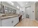 Luxurious bathroom features dual sinks, granite countertops, and modern fixtures at 10084 Terrastone Dr, Las Vegas, NV 89148