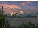 Sunset view of city from community, highlighting nearby landmarks and colorful sky at 10084 Terrastone Dr, Las Vegas, NV 89148