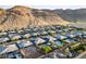 Expansive view of a well-planned community set against a backdrop of rolling hills and clear blue skies at 10084 Terrastone Dr, Las Vegas, NV 89148