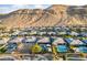Picturesque view of a residential community with homes nestled against a scenic mountain range at 10084 Terrastone Dr, Las Vegas, NV 89148