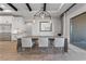 The dining room features a large table, designer lighting, and access to outdoor patio at 10084 Terrastone Dr, Las Vegas, NV 89148