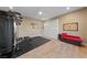 Large exercise room with full equipment and hardwood style flooring at 10084 Terrastone Dr, Las Vegas, NV 89148