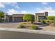 Charming single-story home with manicured landscaping and a stylish stone facade at 10084 Terrastone Dr, Las Vegas, NV 89148