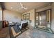 Charming front porch with comfortable seating and a welcoming entrance, perfect for relaxing outdoors at 10084 Terrastone Dr, Las Vegas, NV 89148