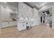 Hallway with a custom built in desk area, granite countertops and hardwood floors at 10084 Terrastone Dr, Las Vegas, NV 89148