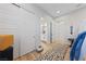 Inviting hallway leads to the bathroom, complemented by modern decor and wood floors at 10084 Terrastone Dr, Las Vegas, NV 89148