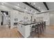 Well-equipped kitchen offers a spacious island with bar seating, stainless steel appliances, and granite countertops at 10084 Terrastone Dr, Las Vegas, NV 89148