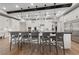 Bright, open kitchen featuring white cabinetry, an oversized island with barstool seating, and stainless steel appliances at 10084 Terrastone Dr, Las Vegas, NV 89148