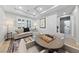 Inviting living room with stylish decor, tray ceilings, and a chessboard table at 10084 Terrastone Dr, Las Vegas, NV 89148