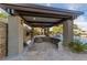 Beautiful outdoor kitchen and bar featuring high end grill and premium seating next to the pool at 10084 Terrastone Dr, Las Vegas, NV 89148