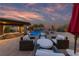Cozy outdoor patio with stylish seating, perfect for enjoying the serene poolside ambiance and sunset views at 10084 Terrastone Dr, Las Vegas, NV 89148