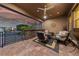 Comfortable covered patio featuring mountain views, complete with stylish seating and outdoor decor at 10084 Terrastone Dr, Las Vegas, NV 89148
