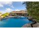 Beautiful pool and spa with open backyard and mountain views on the horizon at 10084 Terrastone Dr, Las Vegas, NV 89148