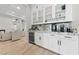 Elegant wet bar features custom cabinetry, granite countertops, and beverage storage at 10084 Terrastone Dr, Las Vegas, NV 89148