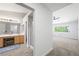 Bright Primary bath with wood-look tile and walk-in shower at 10244 Amber Hue Ln, Las Vegas, NV 89144