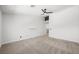 Spacious bedroom featuring a ceiling fan, carpet, and a small shelf at 10244 Amber Hue Ln, Las Vegas, NV 89144