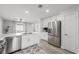 Bright, updated kitchen with stainless appliances and white cabinets provides modern design at 10244 Amber Hue Ln, Las Vegas, NV 89144