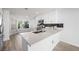 Updated kitchen features stainless steel appliances and a stylish breakfast bar at 10244 Amber Hue Ln, Las Vegas, NV 89144