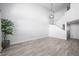 Bright living room with high ceilings, hardwood flooring, and modern light fixture at 10244 Amber Hue Ln, Las Vegas, NV 89144