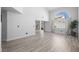 Bright living room with hardwood flooring, an open floor plan and many windows at 10244 Amber Hue Ln, Las Vegas, NV 89144