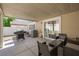 Inviting covered patio with neutral furniture, BBQ, perfect for outdoor grilling and relaxation at 10244 Amber Hue Ln, Las Vegas, NV 89144