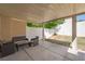 Inviting covered patio with neutral furniture, offering a comfortable outdoor living space at 10244 Amber Hue Ln, Las Vegas, NV 89144