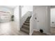 Carpeted stairs with neutral decor connects the home's multiple levels at 10244 Amber Hue Ln, Las Vegas, NV 89144