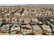 Extensive aerial shot of a residential neighborhood featuring varied home styles and desert landscape at 10417 Artful Stone Ave, Las Vegas, NV 89149