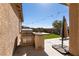 Backyard with built-in grill, counterspace, and patio umbrella at 10417 Artful Stone Ave, Las Vegas, NV 89149
