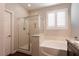 Bathroom featuring shower, tub, and vanity with granite counters at 10417 Artful Stone Ave, Las Vegas, NV 89149