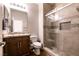 Modern bathroom featuring granite countertops and a glass shower at 10417 Artful Stone Ave, Las Vegas, NV 89149