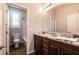 Well-lit bathroom featuring single sink, vanity, granite counter, and shower at 10417 Artful Stone Ave, Las Vegas, NV 89149