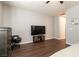 Large bedroom boasts wood floors, neutral walls, and a media center at 10417 Artful Stone Ave, Las Vegas, NV 89149