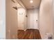 Bright foyer featuring wood-look flooring and white doors leading to various rooms at 10417 Artful Stone Ave, Las Vegas, NV 89149