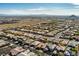 An aerial view showcasing a sprawling neighborhood with mountain views in the distance at 10417 Artful Stone Ave, Las Vegas, NV 89149