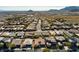 Neighborhood aerial showing tidy streets and diverse home styles against a desert backdrop at 10417 Artful Stone Ave, Las Vegas, NV 89149