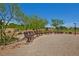 Inviting park benches in a peaceful green space, perfect for community enjoyment at 10417 Artful Stone Ave, Las Vegas, NV 89149