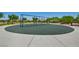 Neighborhood playground with swings and a soft landing surface and sidewalk for easy access at 10417 Artful Stone Ave, Las Vegas, NV 89149