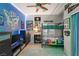 Fun bedroom with a bunkbed, flat screen TV and BYU Cougar themed decor and under cabinet lighting at 10754 Balmoral St, Las Vegas, NV 89141