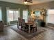 Cozy dining room with a large table, stylish chairs, and ample natural light at 10754 Balmoral St, Las Vegas, NV 89141