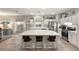 Bright kitchen featuring a large island with seating and stainless steel appliances at 10754 Balmoral St, Las Vegas, NV 89141