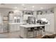 Spacious kitchen with white cabinetry, stainless steel appliances, and center island with barstool seating at 10754 Balmoral St, Las Vegas, NV 89141