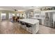 Bright kitchen with an island and an adjoining dining room and living room at 10754 Balmoral St, Las Vegas, NV 89141
