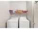 Practical laundry area featuring a side by side washer and dryer at 10754 Balmoral St, Las Vegas, NV 89141
