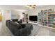 Open living room with a comfortable sofa, bookshelves, and stylish decor at 10754 Balmoral St, Las Vegas, NV 89141