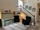 Elegant living room with piano, plush chairs, and decorative staircase at 10754 Balmoral St, Las Vegas, NV 89141
