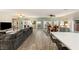 Spacious living room with hardwood floors, large sofa and adjacent dining area at 10754 Balmoral St, Las Vegas, NV 89141